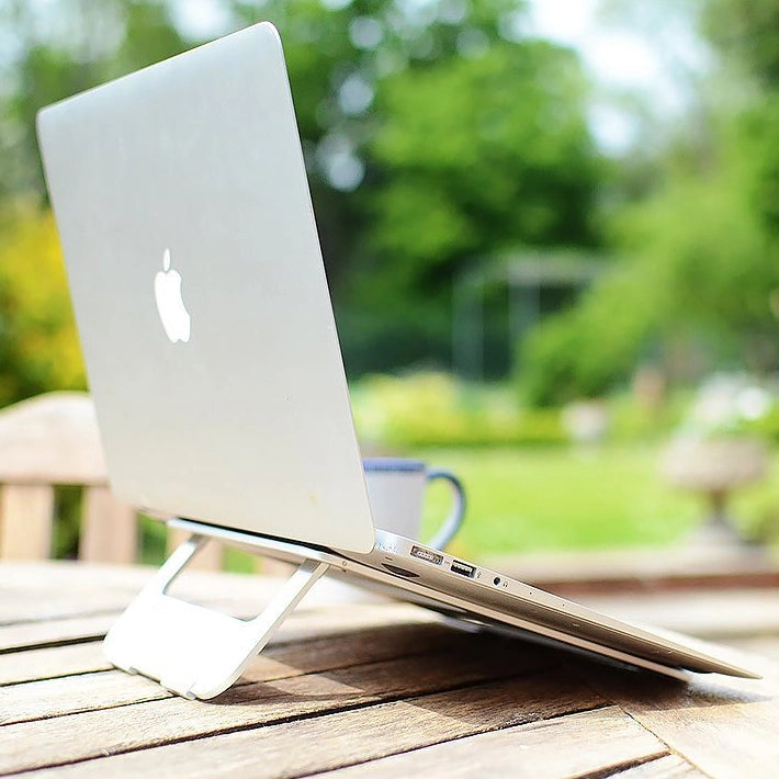 best travel laptop stand macbook stand in a garden with a macbook air 