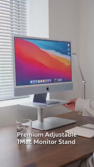A video of the silver carbon steel monitor stand being used and its functions 